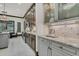 Kitchen boasts granite countertops, herringbone backsplash, stainless appliances, and lots of cabinet space at 2388 Baronsmede Ct, Winter Garden, FL 34787