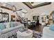 Elegant living space with hardwood floors, arched doorways, and a formal dining area nearby at 2388 Baronsmede Ct, Winter Garden, FL 34787