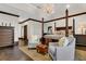 This bedroom features hardwood floors, tray ceilings, a chandelier and traditional furnishings at 2388 Baronsmede Ct, Winter Garden, FL 34787