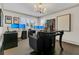 Home office setup with multiple monitors, comfortable seating, and natural light at 2388 Baronsmede Ct, Winter Garden, FL 34787