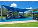Colorful playground with slides, climbing areas, and sunshade, designed for fun and safe play in the community at 2388 Baronsmede Ct, Winter Garden, FL 34787