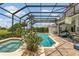 Beautiful backyard featuring pool, spa, outdoor kitchen, and screened lanai at 2388 Baronsmede Ct, Winter Garden, FL 34787