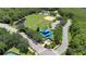 Aerial view of a well-maintained recreational area featuring sports fields, playground, and picnic spots at 2388 Baronsmede Ct, Winter Garden, FL 34787