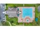 Aerial view of a sparkling community swimming pool area, perfect for relaxation and recreation at 2388 Baronsmede Ct, Winter Garden, FL 34787