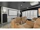 Home theater with comfortable seating, a projector screen, and custom millwork at 2388 Baronsmede Ct, Winter Garden, FL 34787