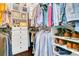 This walk-in closet with custom shelving and drawers provides storage solutions at 2388 Baronsmede Ct, Winter Garden, FL 34787