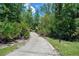 Scenic walking path with lush landscaping at 2388 Baronsmede Ct, Winter Garden, FL 34787