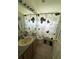 Cozy bathroom featuring shower and tub combo, vanity and neutral design elements at 2515 La Jolla Trl, Kissimmee, FL 34747