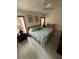 Cozy main bedroom featuring a ceiling fan, neutral paint and hardwood floors at 2515 La Jolla Trl, Kissimmee, FL 34747