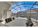 Outdoor patio area features a dining area and swimming pool and spa at 2515 La Jolla Trl, Kissimmee, FL 34747