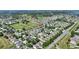 Expansive aerial showcases a community with an open green space at 264 Milestone Dr, Haines City, FL 33844