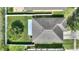 Overhead view of the house showing the roof, backyard, fence, and the green grass at 264 Milestone Dr, Haines City, FL 33844