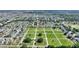 Expansive aerial view of a suburban community featuring numerous homes and a meticulously maintained lawn at 264 Milestone Dr, Haines City, FL 33844