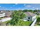 Spacious backyard with a large tree, green grass, and a white fence, offering privacy at 264 Milestone Dr, Haines City, FL 33844