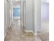Inviting hallway with neutral tones, leading to rooms filled with natural light at 264 Milestone Dr, Haines City, FL 33844