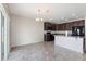 Bright kitchen with granite countertops, stainless steel appliances, and an adjacent dining area at 264 Milestone Dr, Haines City, FL 33844