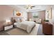 Stylish main bedroom boasting a tray ceiling, neutral tones, and modern furnishings at 264 Milestone Dr, Haines City, FL 33844
