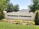 Community entrance sign with manicured landscaping welcomes residents to Stonewood Crossings at 264 Milestone Dr, Haines City, FL 33844