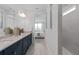 Bathroom with double vanity and countertops, with an ensuite bathroom and walk-in shower at 2674 Midsweet Ave, St Cloud, FL 34772
