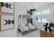 Stylish ' bedroom with a bunk bed, comfortable seating, and modern decor accents at 2674 Midsweet Ave, St Cloud, FL 34772