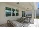 Covered patio features a seating area and outdoor dining, perfect for entertaining at 2674 Midsweet Ave, St Cloud, FL 34772