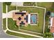 Enjoy aerial views of this home with an in-ground pool, screened-in enclosure, solar panels, and fenced-in yard at 2725 White Magnolia Loop, Clermont, FL 34711