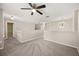 Spacious hallway with neutral carpet and modern light fixtures at 2725 White Magnolia Loop, Clermont, FL 34711