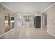Bright, open kitchen with white cabinetry, stainless appliances and tile floors at 2725 White Magnolia Loop, Clermont, FL 34711