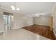 Large living room with tile and wood flooring, ceiling fan and neutral colors at 2725 White Magnolia Loop, Clermont, FL 34711