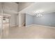 Spacious living room features tile flooring, neutral colors, and decorative lighting at 2725 White Magnolia Loop, Clermont, FL 34711