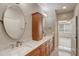 Bathroom boasts double sinks with stone counters and a vanity with drawer storage at 2763 Metro Sevilla Dr # 103, Orlando, FL 32835