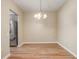 Dining room with modern flooring and an elegant hanging chandelier light at 2763 Metro Sevilla Dr # 103, Orlando, FL 32835