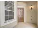 Charming front entrance with a classic door, exterior light fixture, and welcoming ambiance at 2763 Metro Sevilla Dr # 103, Orlando, FL 32835