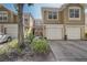 Inviting townhome exterior with a one-car garage and well-maintained landscaping in a friendly community at 2763 Metro Sevilla Dr # 103, Orlando, FL 32835