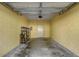 Garage with shelving provides ample storage for vehicles and tools at 2763 Metro Sevilla Dr # 103, Orlando, FL 32835