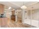 Efficient kitchen with modern appliances, wood cabinets, and easy access to the dining and living areas at 2763 Metro Sevilla Dr # 103, Orlando, FL 32835
