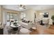 Cozy living room with a ceiling fan, modern furniture and sliding glass doors to the outdoor patio at 2763 Metro Sevilla Dr # 103, Orlando, FL 32835