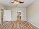 Spacious main bedroom boasts wood flooring and an ensuite bathroom at 2763 Metro Sevilla Dr # 103, Orlando, FL 32835