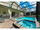 Gorgeous screened pool area with attached spa, paver deck, and covered lanai, ideal for outdoor living at 2816 Simile St, Kissimmee, FL 34746