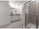 Bathroom featuring double sinks, shower with glass door, and tile flooring at 2816 Simile St, Kissimmee, FL 34746