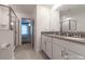 Well-lit bathroom with double vanity, a glass shower, and modern fixtures at 2816 Simile St, Kissimmee, FL 34746