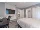 Neutral bedroom with a desk, television and grey carpeting at 2816 Simile St, Kissimmee, FL 34746