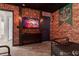 Nicely appointed themed bedroom with entertainment center and brick-style wall at 2816 Simile St, Kissimmee, FL 34746
