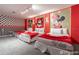 A fun bedroom features three beds and colorful wall decor at 2816 Simile St, Kissimmee, FL 34746