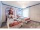 Cozy bedroom with themed wall art, a statement light fixture and twin beds at 2816 Simile St, Kissimmee, FL 34746