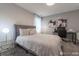 Neutral bedroom with a work space and decorative artwork at 2816 Simile St, Kissimmee, FL 34746