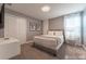 A calming primary bedroom featuring gray decor, soft textures, and ample closet space at 2816 Simile St, Kissimmee, FL 34746