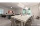 Dining area adjacent to a modern living room and featuring a view of the backyard pool at 2816 Simile St, Kissimmee, FL 34746
