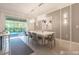 Dining room featuring a modern chandelier over a large white table and stylish chairs at 2816 Simile St, Kissimmee, FL 34746