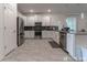 Modern kitchen featuring stainless steel appliances, sleek white cabinets, and stylish backsplash at 2816 Simile St, Kissimmee, FL 34746
